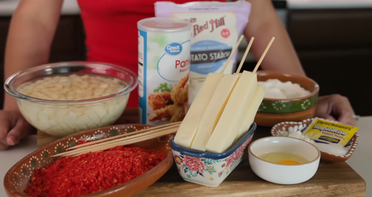 Finished Korean corn dogs with cheese pull sugar coating and ketchup drizzle