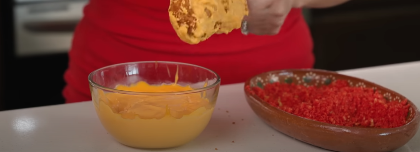 Deep frying Korean corn dogs until golden brown