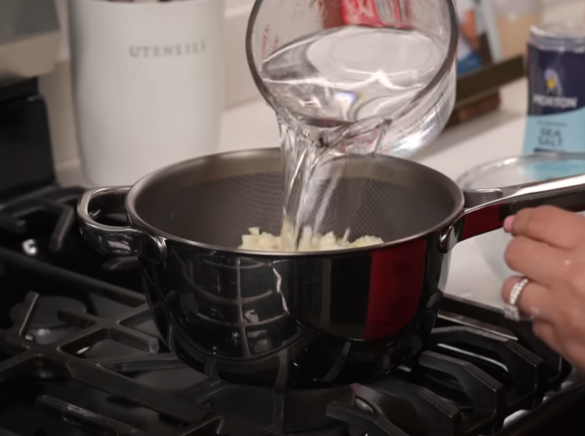 Preparing Korean corn dog fillings on a cutting board